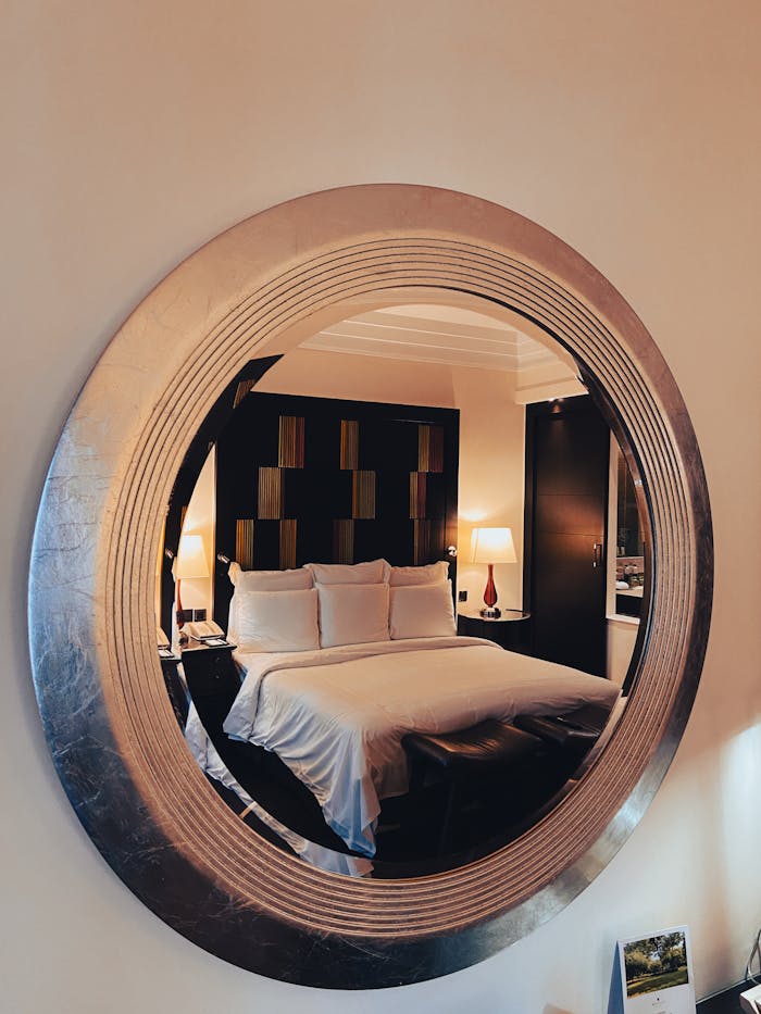 services-01 elegant-hotel-room-reflected-in-circular-mirror-34455152
